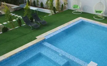 Pool and lounge at dusk